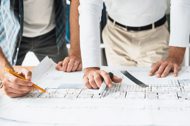 close-up-two-male-architect-s-hand-blueprint 1 (1)